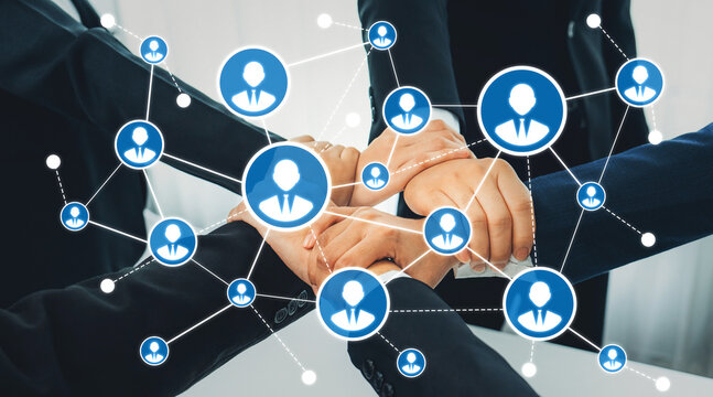 This image illustrates a collaborative business networking concept with hands joining together, symbolizing teamwork and digital connections, showcasing professional relationship-building. Amity - Powered by Adobe
