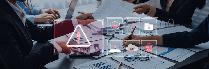 Business Team Collaborating on Financial Reports with Digital Security Icons for Data Protection and Risk Management in Modern Office Environment Trope.
