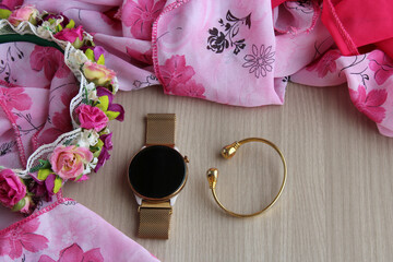 Set of women&rsquo;s accessories, including wrist watch, golden bracelet and tiara. Horizontal shot with copy space, ideal for fashion and feminine themes, beauty content, and lifestyle blogs.