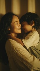 Happy asian mother hugging her child.	