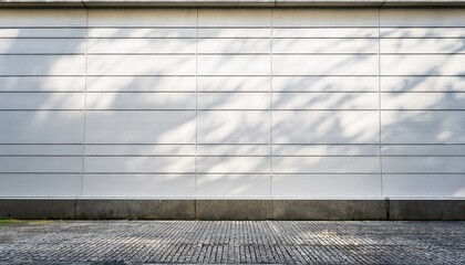 whitewashed wall beside a city sidewalk