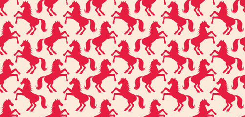Seamless pattern with rearing horse silhouettes in red. Repeating equestrian animal motif. Vector background for fabric, wallpaper, wrapping paper, textile, fashion prints and decorative design.