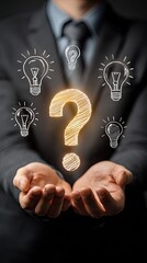Businessman holding glowing question mark with floating light bulbs