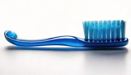 Close-up of a blue toothbrush on a white surface, dental hygiene concept.