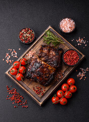 Grilled or barbecued pork or beef ribs, meat with red sauce for the dinner table. Grilled ribs