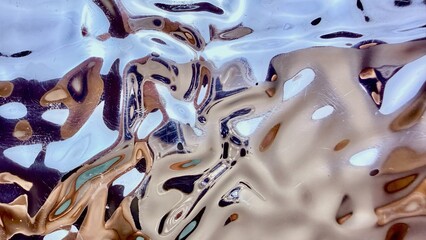 shimmering liquid metal waves rippling in ethereal blue gold tones abstract fluid surface reflecting light for futuristic wallpaper background