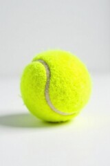 Single tennis ball, bright yellow, white background, design, leisure, sphere