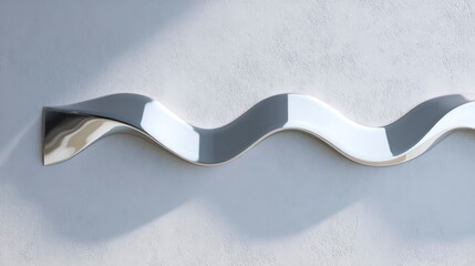 Close-up shot of puddle-shaped mirror on light wall with flowing chrome surface and wave distortions, concept of Liquid mirrors  