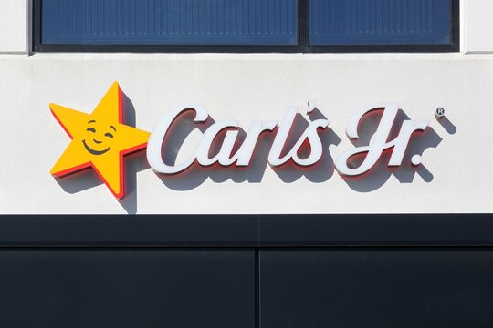 Horsens, Denmark - March 15, 2025: Carl's jr logo on a wall. Carl's jr is an American fast food restaurant chain operated by CKE Restaurant Holdings, Inc
