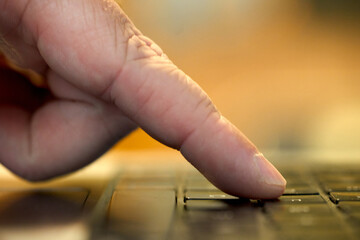 Fingers typing on keyboard
