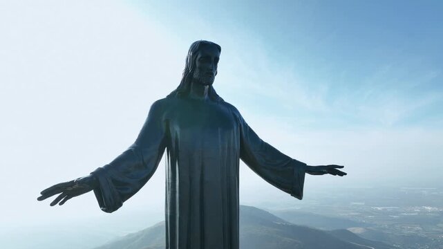 Christ the King in the sky, metal structure atop a mountain against a Mexican landscape, at a natural sunrise