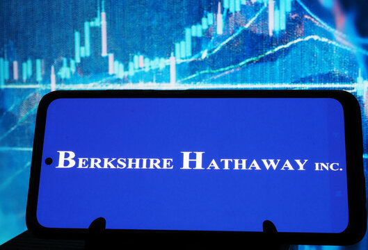 In this photo illustration, Berkshire Hathaway Inc. logo seen displayed on a monitor.