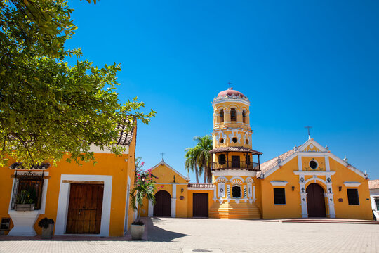 The beautiful historic Church of Santa Barbara built in 1613 with a balcony on its bell tower at the colonial Heritage Town of Santa Cruz de Mompox in Colombia.