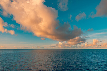 Beautiful stunning seascape horizon with blue ocean idyllic sunset sky clouds picturesque scenic breathtaking serene calm relaxing dreamy natural coastal landscape background. Inspire nature outdoors