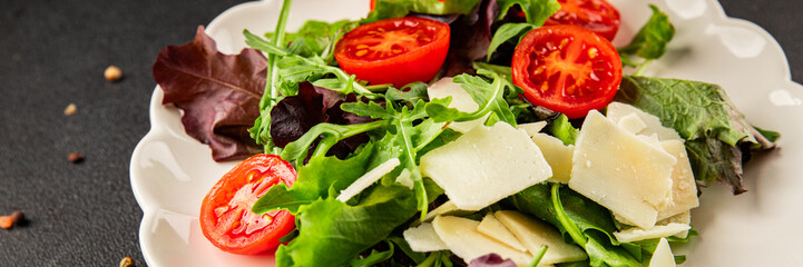 Parmesan cheese vegetable salad tomato, arugula, green leaf lettuce healthy food main course ingredient appetizer fresh tasty gourmet food background food top view copy space vegetarian food