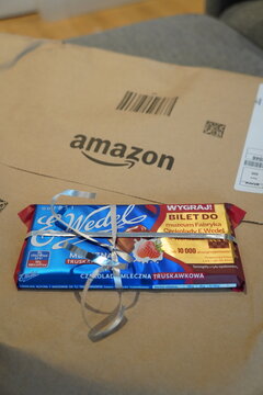 Amazon package with a strawberry chocolate bar and a contest ticket inside