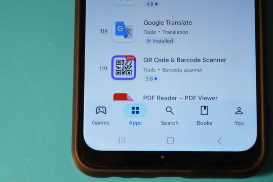 Smartphone screen displaying app store with QR code scanner and Google Translate