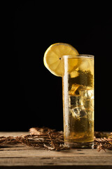 Refreshing Green Tea With Ice and Lemon Served in a Tall Glass on a Wooden Table