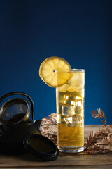 Enjoying Green Tea With Ice on a Wooden Table Under Soft Lighting