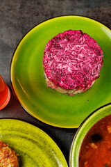 Obraz premium Explore various dishes from Ukrainian cuisine and Japanese cuisine displayed on colorful plates in a vibrant setting