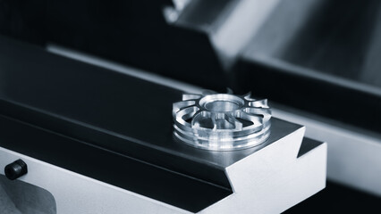 Complex metal work on machine table, made on modern programmable CNC multifunctional metalworking...