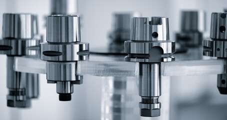 A series of metal chucks for mounting drilling and milling tools in modern metalworking CNC programmable multifunctional machines, industrial concept background © Aleksandr Matveev