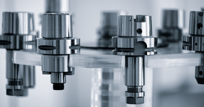 A series of metal chucks for mounting drilling and milling tools in modern metalworking CNC programmable multifunctional machines, industrial concept background