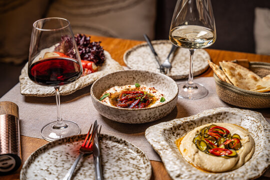 Arabic Mezze Table With Hummus And Wine