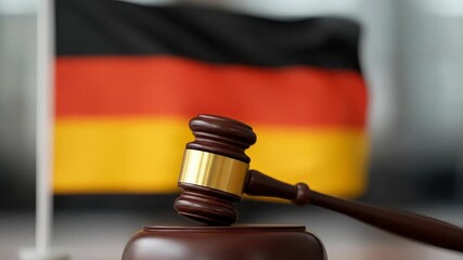 A judge's gavel sits before the German flag, embodying the nation's Basic Law, democratic principles, justice system, and the spirit of German Unity Day