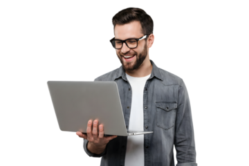 Happy young bearded man in glasses smiling while looking at a laptop computer, isolated on transparent background