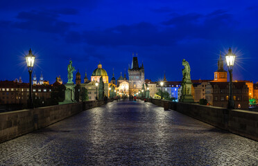 Night view of Charles Bridge in Prague, Czech Republic. The Charles Bridge is one of the most visited sights in Prague. Architecture and landmark of Prague