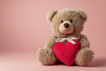 Obraz premium Brown Teddy Bear Holding Red Heart on Pink Background