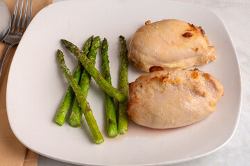 chicken thighs derved with asparagus