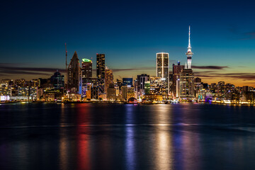 Auckland City Skyline at Night with Sky Tower Reflections on the Harbour