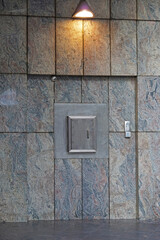 Night safe deposit box at bank wall marble stone exterior