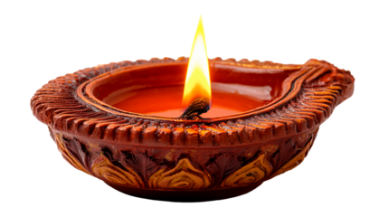 Burning clay Diya lamp with cotton wick placed on a flat surface during a cultural celebration or evening event