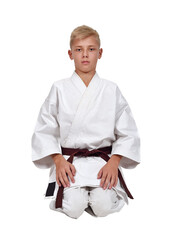 Martial artist sitting in white kimono.