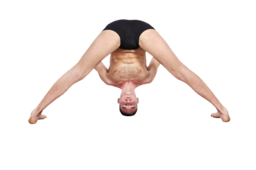 A muscular man doing a yoga asana.