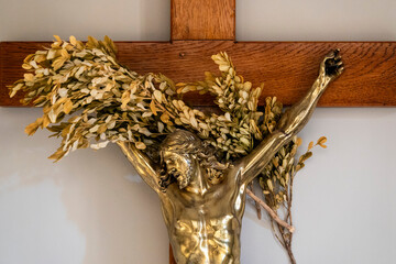 Golden metal statue (19th century) of Face of Jesus Christ crucified on the cross.