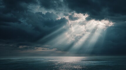 Obraz premium ocean with clouds and sunbeams through the clouds