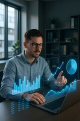 Young man analyzing financial data and business statistics on an interactive holographic interface over his laptop in an office