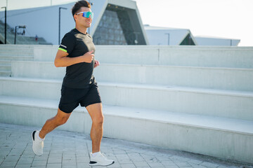 Runner enjoying exercise near modern buildings