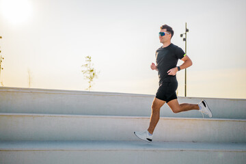 Runner moves quickly on steps in outdoor space