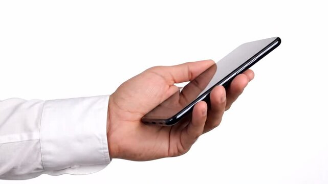 Close up hand holding black smartphone with a clean white background and an arm dressed in a white long sleeve shirt featuring a modern device.