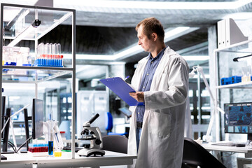 Scientist working in a laboratory workspace with biotechnology and molecular biology tools, clinical testing and healthcare research. Pharmaceutical development and data in modern science.