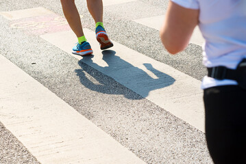 Shadow of runner on the road