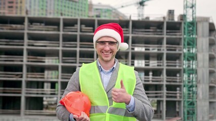 Project manager showing approval of construction works before camera