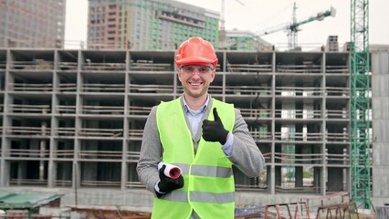 Cheerful site supervisor approving construction works during on-site audit