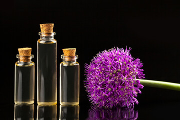 onion essential oil in  beautiful bottle on table