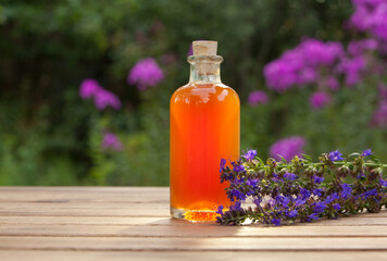 hyssop essential oil in  beautiful bottle on table